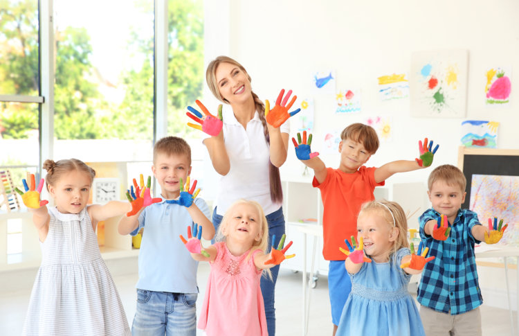 toddlers with their day care teacher